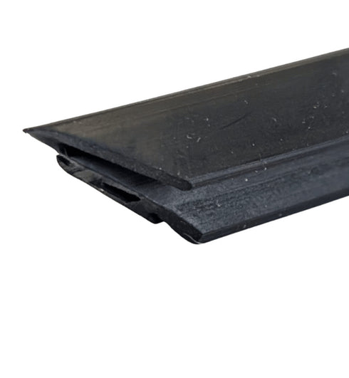 Black rubber door seal strip on a white background